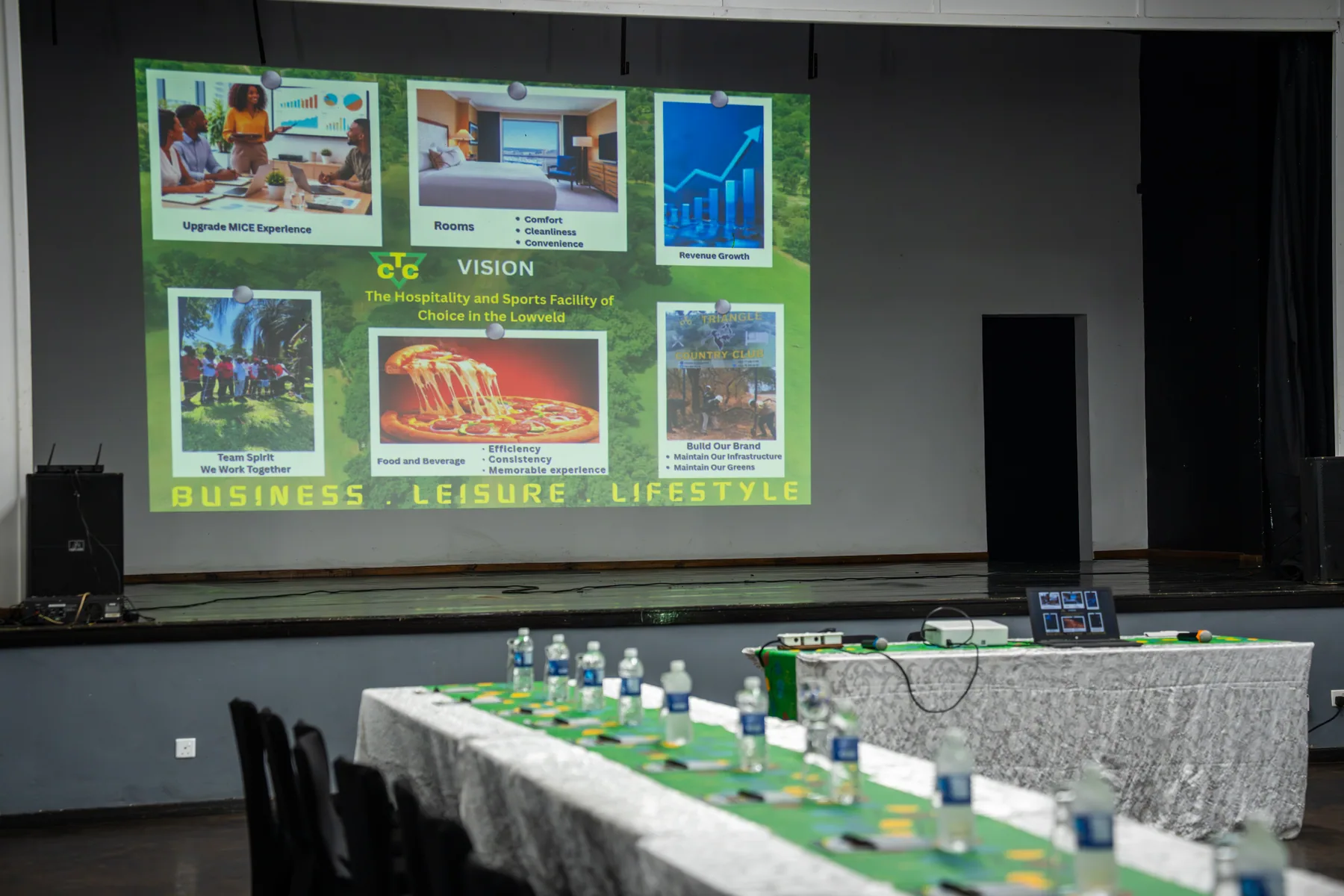 The conference hall with the club's vision on screen