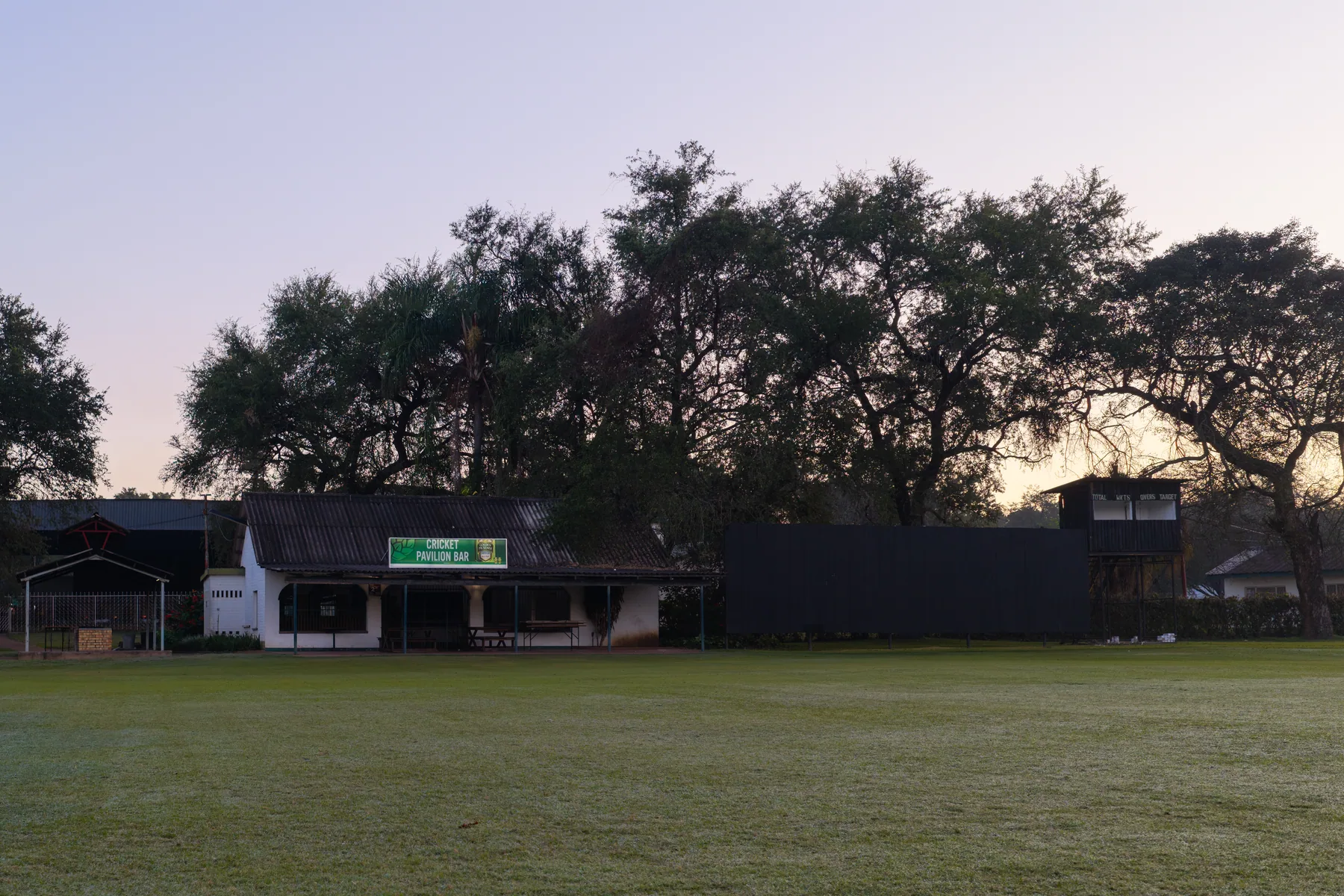 The cricket ground and pavilion at dusk